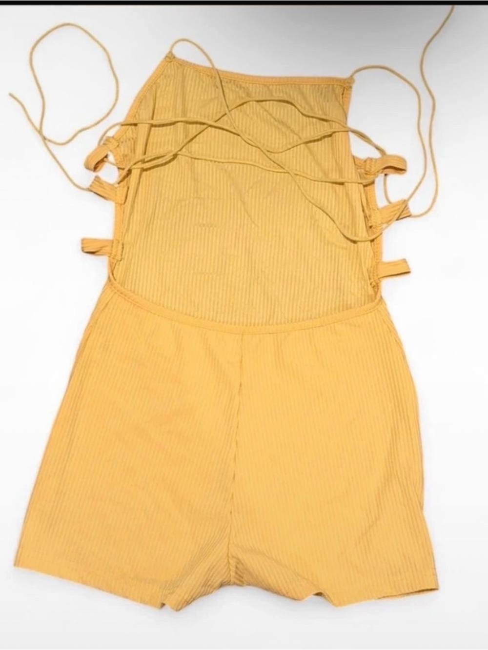 Yellow ribbed romper with backless strappy design